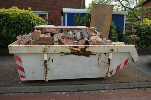 Professional flat clearance crew removing furniture from a Wimbledon flat