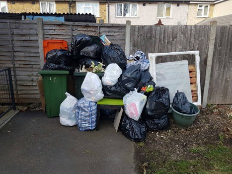 Professional team clearing a garage in Wimbledon