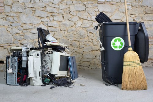 Team removing garden debris in a Wimbledon backyard